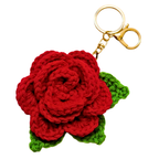 Crocheted red rose keychain with a gold clasp on a white background