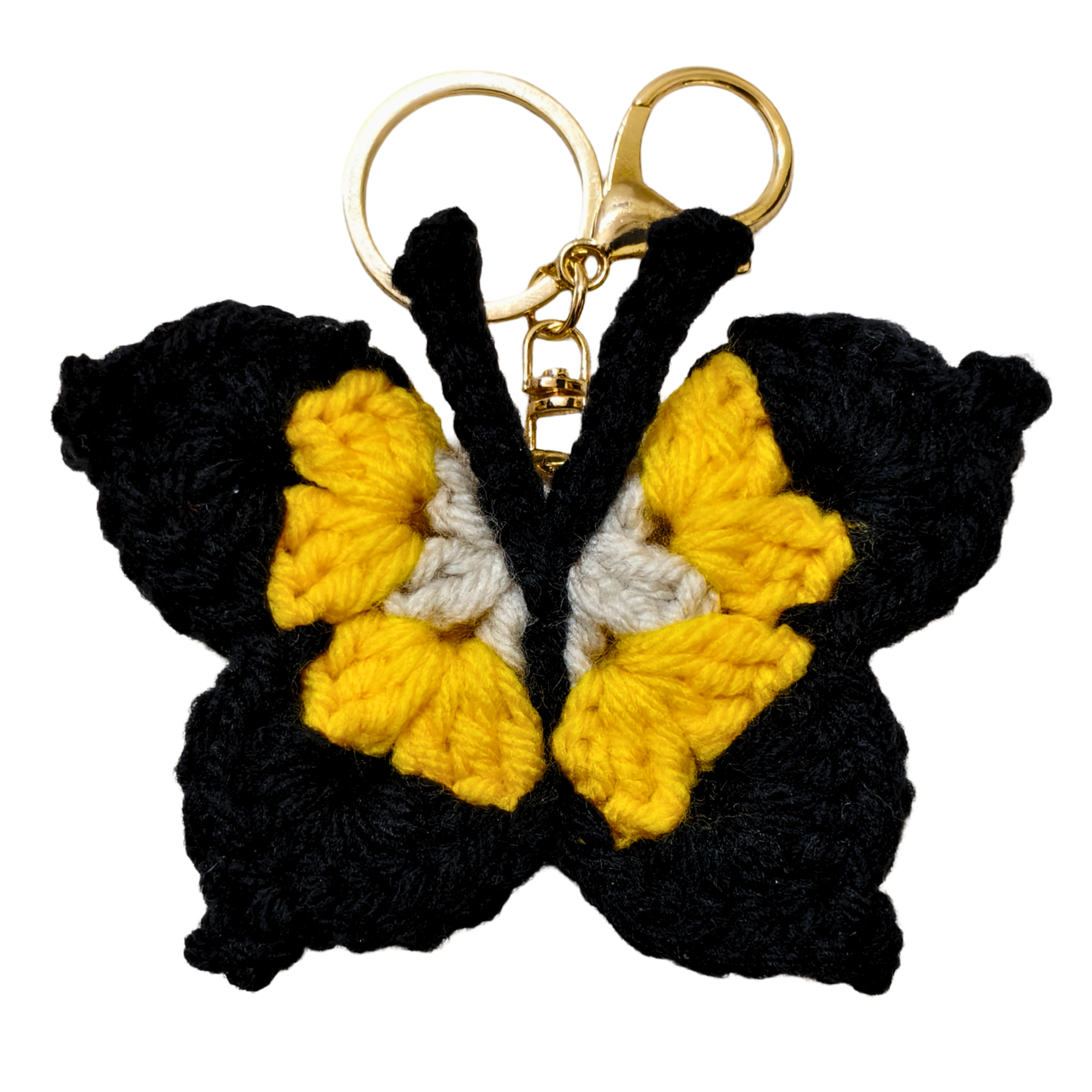 Butterfly-shaped keychain with black, yellow, and white wings on a white background