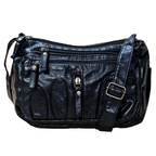 Black leather handbag with multiple zippers on a white background