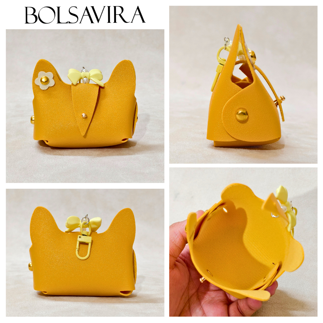 Yellow cat-shaped handbag with a bow and flower detail, shown from multiple angles on a light background.