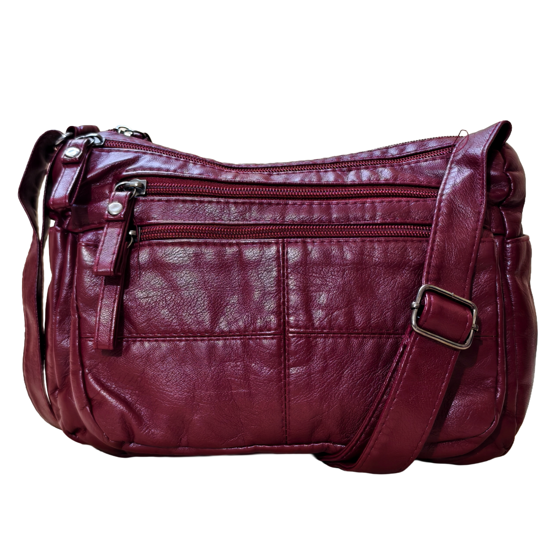 Maroon leather handbag with multiple compartments on a white background