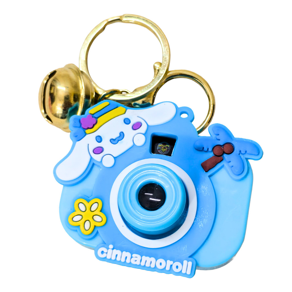 Blue camera-shaped keychain with cartoon character design on a white background