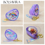 Collage of a purple coin purse with unicorn design and keychain on a beige background, featuring the brand 'BOLSAVIRA'.