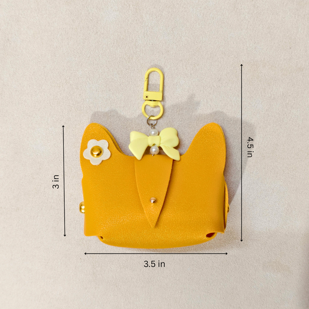 Yellow cat-shaped pouch with measurements on a beige background