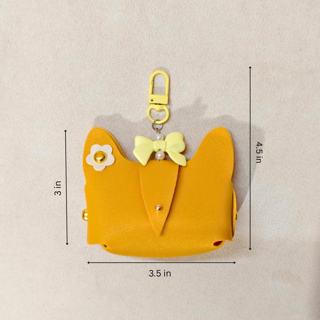 Yellow cat-shaped pouch with measurements on a beige background