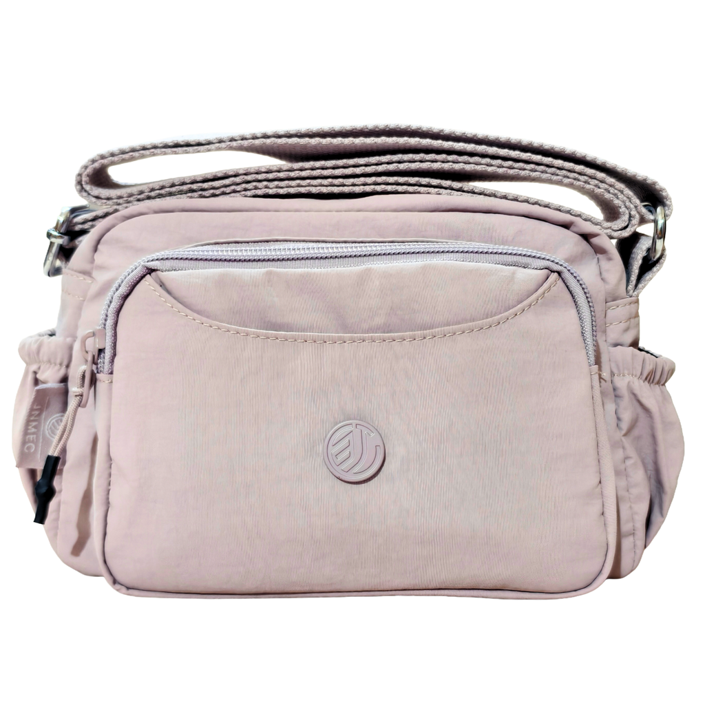 Lavender Lilac Sling Bag In Front Of White Background.