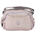 Lavender Lilac Sling Bag In Front Of White Background.