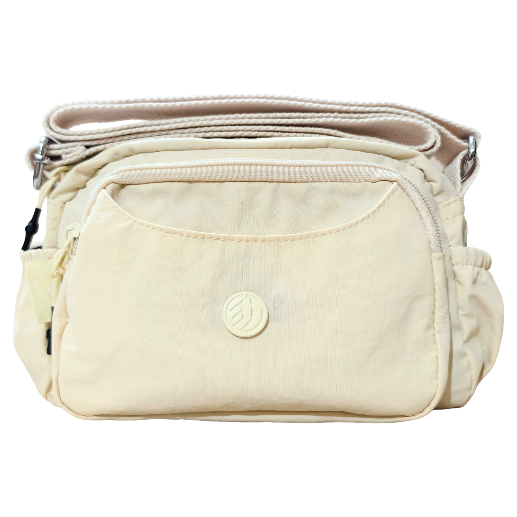 Cream Ivory Sling Bag In Front Of White Background.
