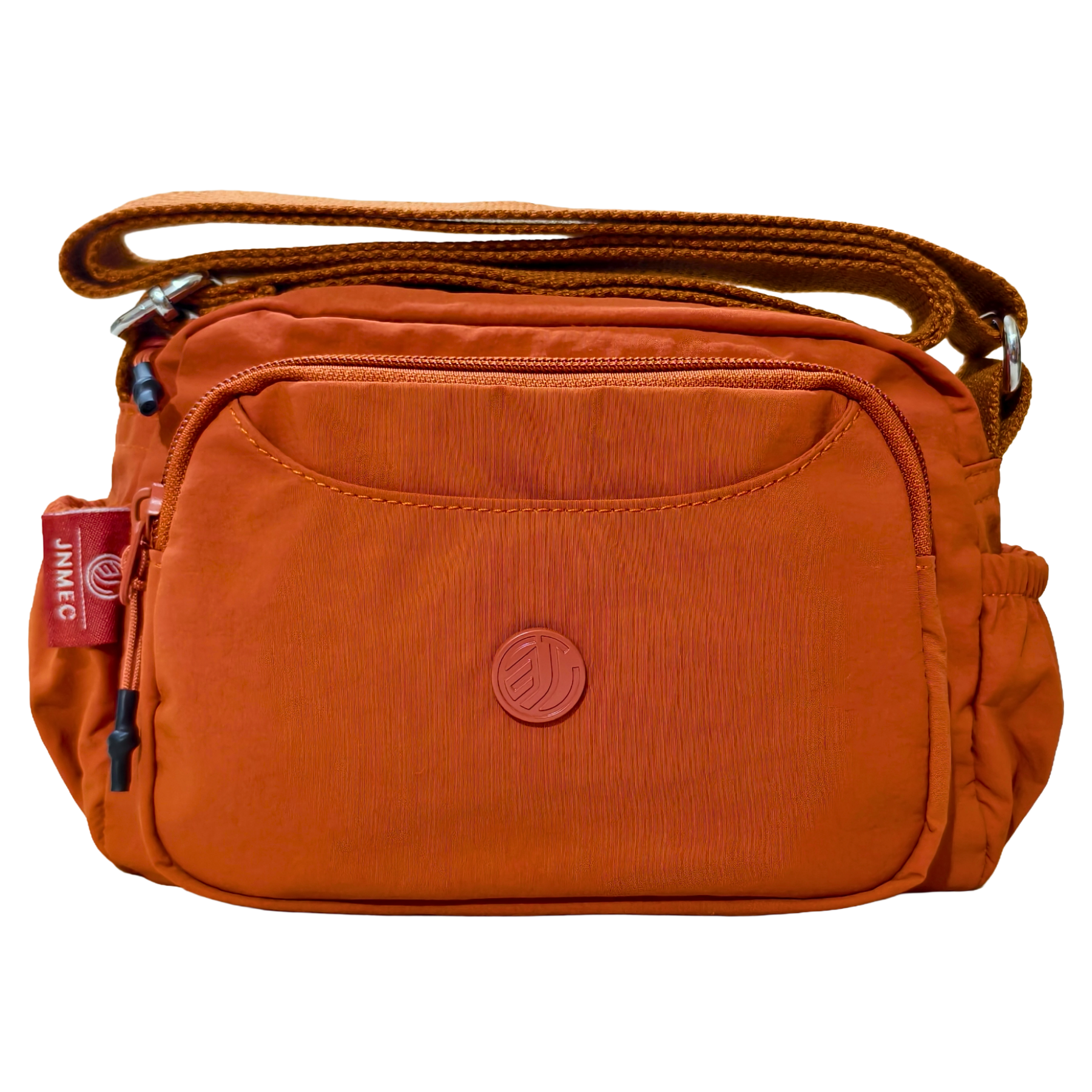 Rust Brown Sling Bag In Front Of White Background.