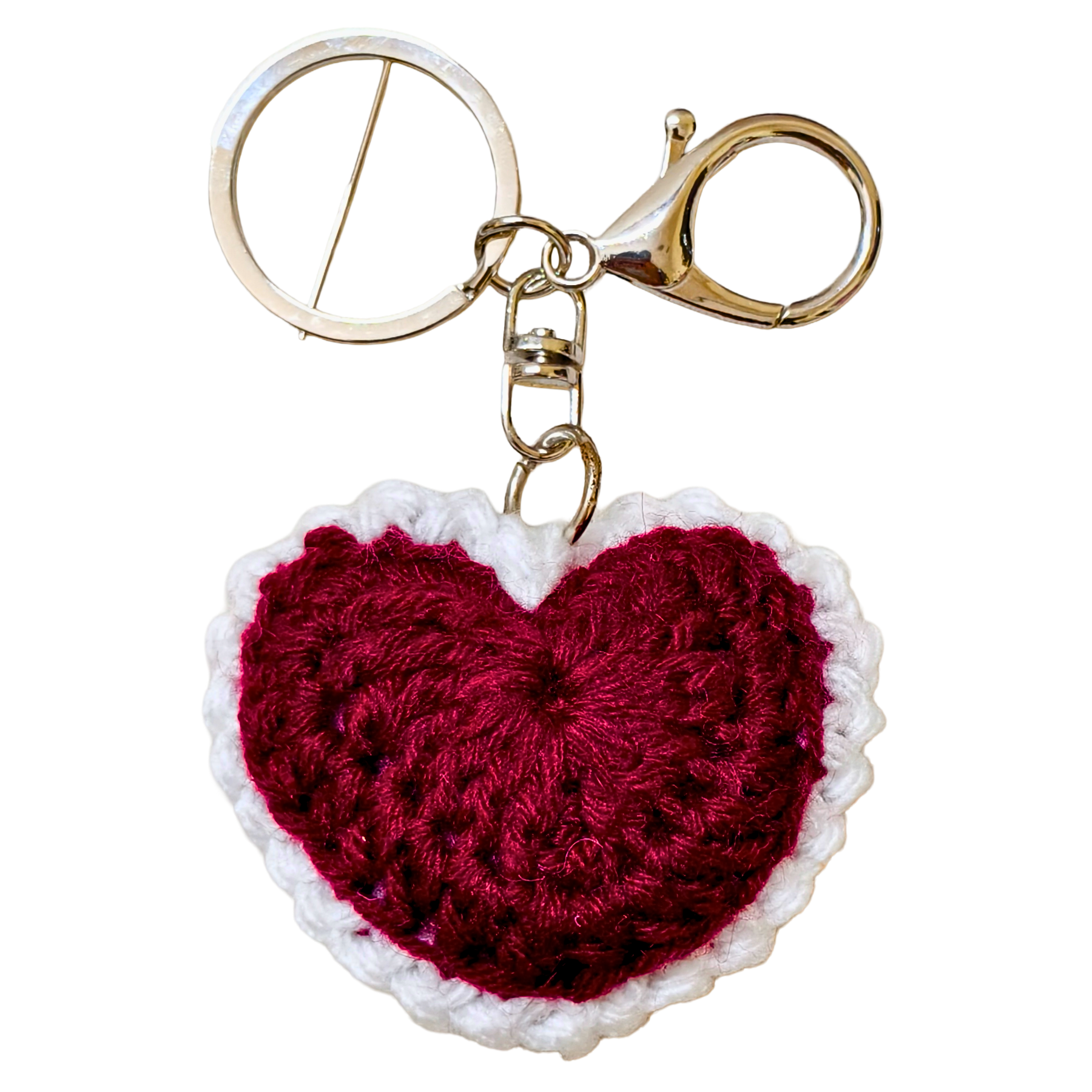 Heart-shaped keychain with red center and white border on a white background