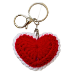 Red heart-shaped keychain with white border on a white background