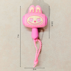 Pink bunny-shaped wall hook with a beaded wrist strap, shown on a beige background with dimension lines indicating 7 in height, 3.5 in width, and 3 in depth.