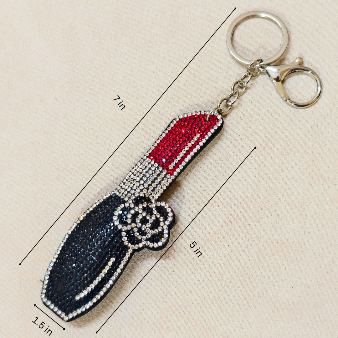 Keychain shaped like a lipstick with measurements on a beige background