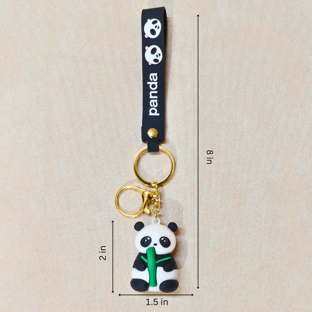 Panda keychain with measurements on a beige background
