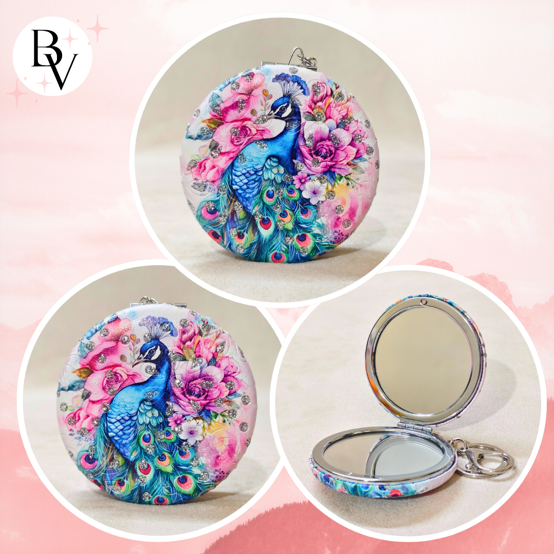 Compact mirror with peacock design on a pink background