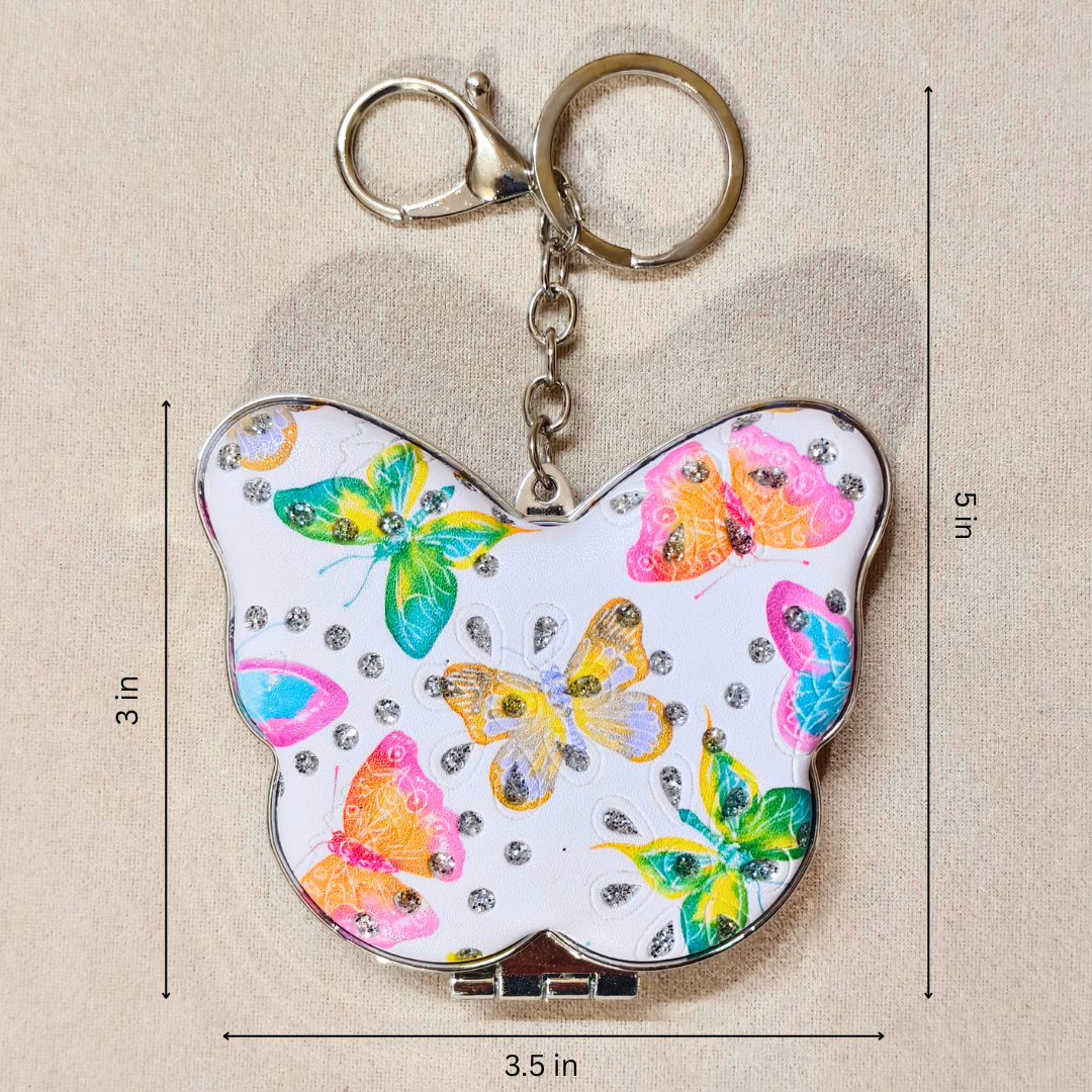 A butterfly-shaped keychain with a white background and colorful butterfly prints, shown with dimension markings of 3 in by 5 in and 3.5 in.