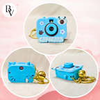 Capybara-shaped blue camera keychain with gold chain on a pink background