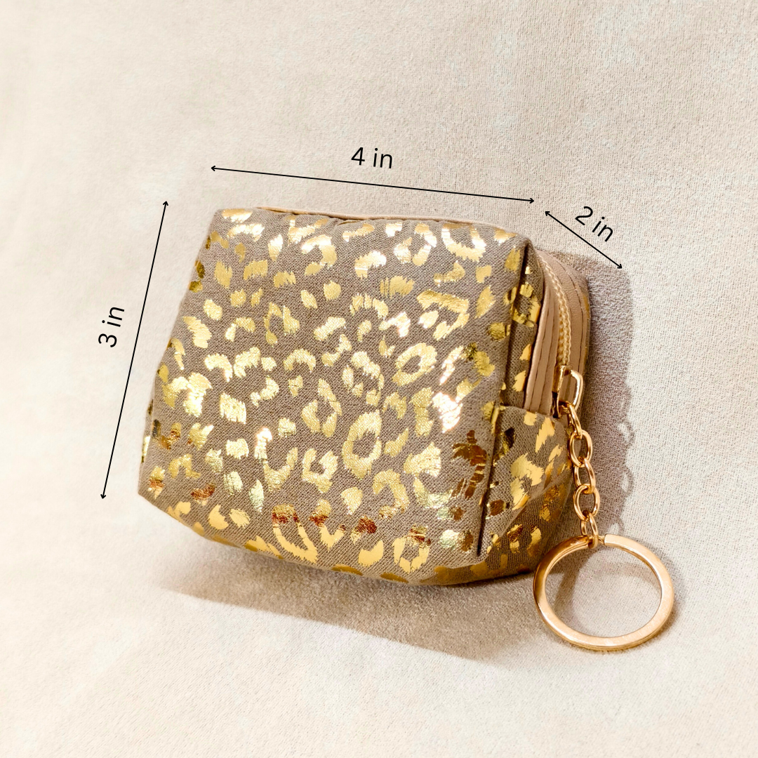 Gold leopard print pouch with keychain on a beige background, showing dimensions.