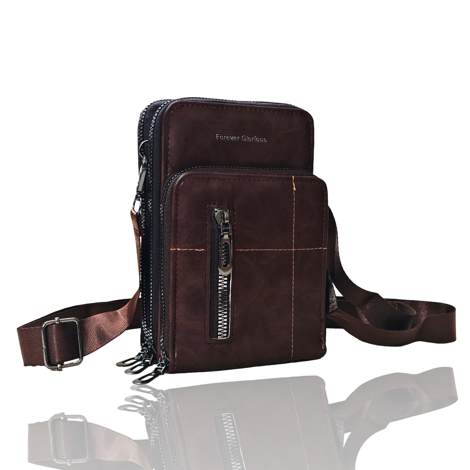 Brown leather crossbody bag with multiple zippers on a white background