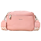 A pink pebbled faux-leather crossbody bag with a silver zipper, a silver metal 'Beauty' logo on the front, and a patterned pink and white shoulder strap, shown against a plain white background.