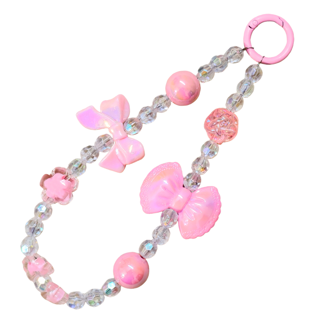 Pink Bow Charm In Front Of White Background