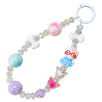 Colorful beaded keychain with cartoon owl charm on a white background
