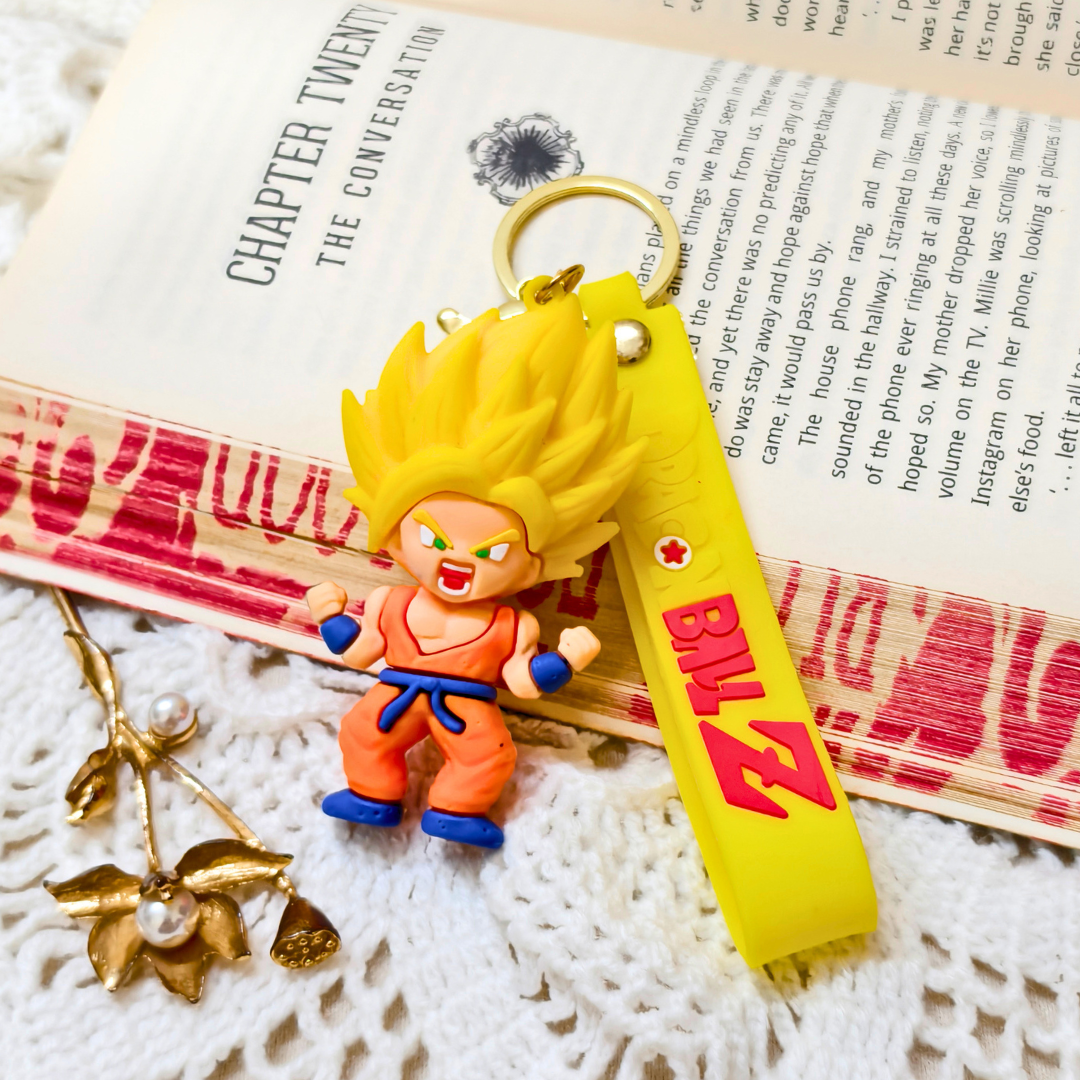 Super Saiyan Key Ring Along With Props On Crochet Background.