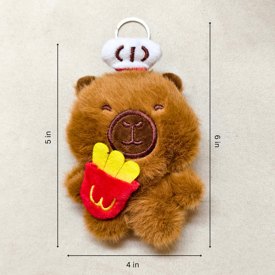 Plush bear keychain with measurements on a beige background
