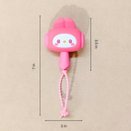 Pink cartoon character with a measurement label on a beige background
