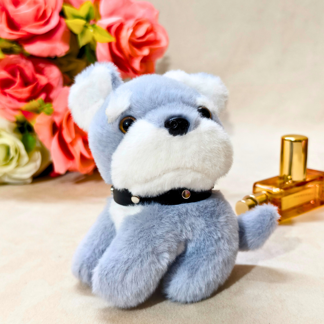 Plush dog toy with a bottle of perfume and flowers in the background