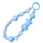 Blue baby teething toy with bear and flower designs on a white background