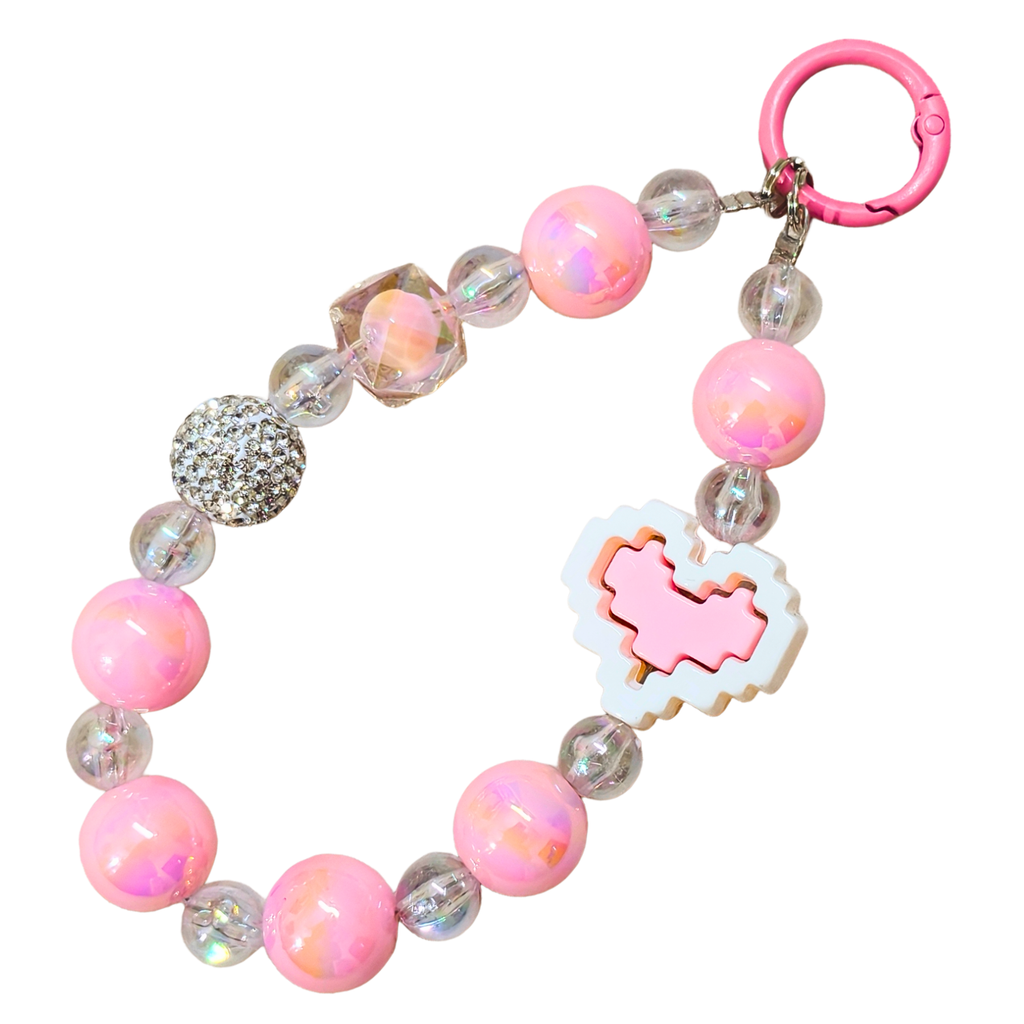 Pink beaded bracelet with a heart charm on a white background