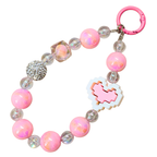 Pink beaded bracelet with a heart charm on a white background