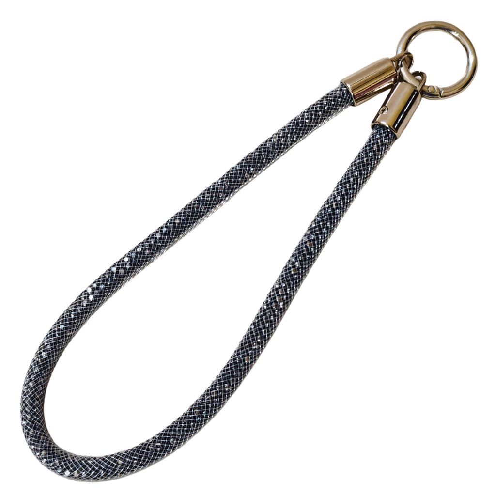 Dog leash with braided design and brass clasp on a white background