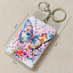 Card holder with butterfly design and keychain on a beige background