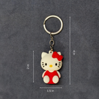 Keychain with cartoon character measurement on a dark gray background