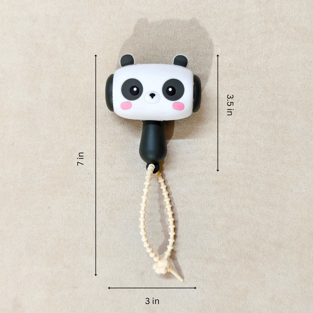 Panda-shaped toy with measurements on a beige background