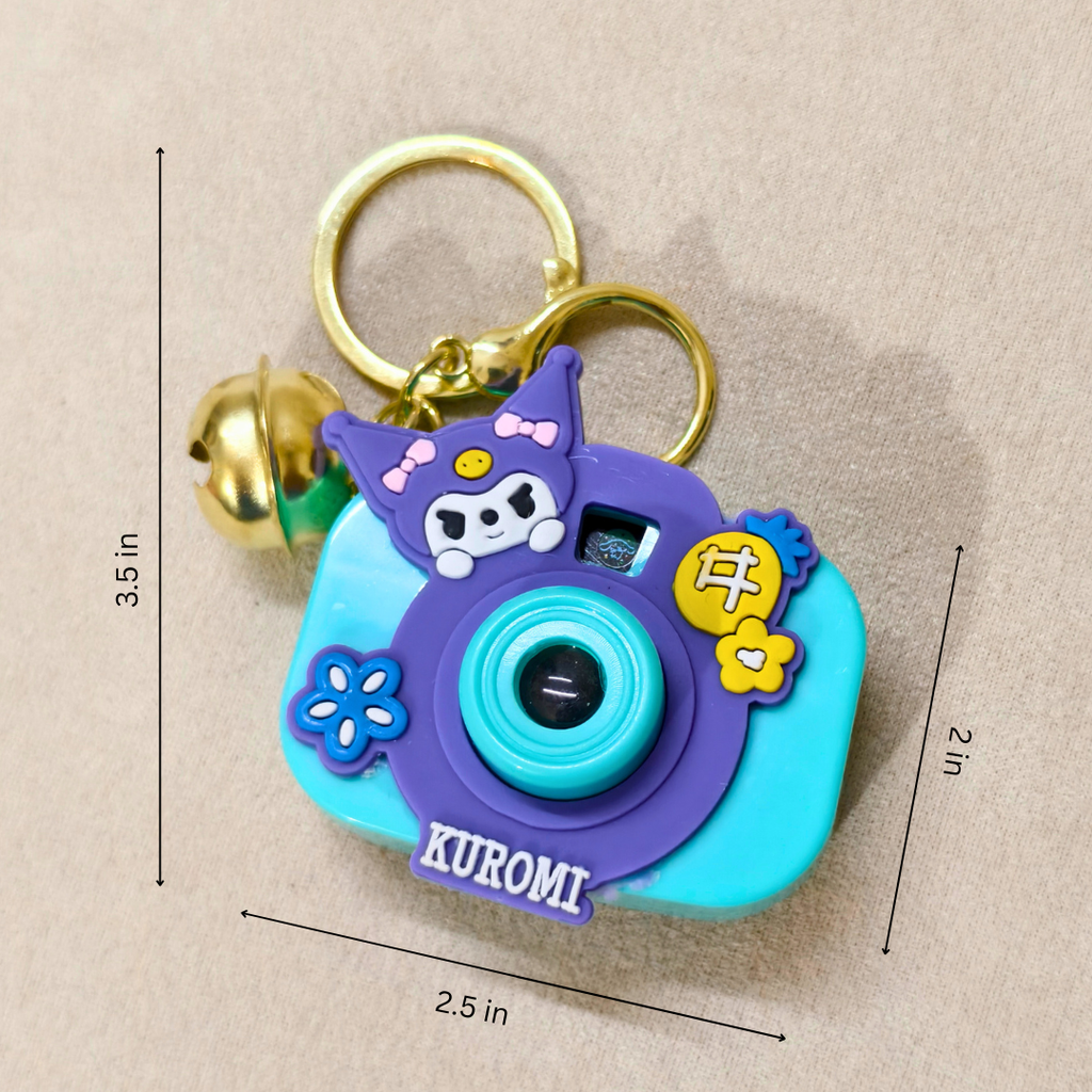 Colorful keychain with camera design and 'KUROMI' branding, featuring measurements on a beige background.