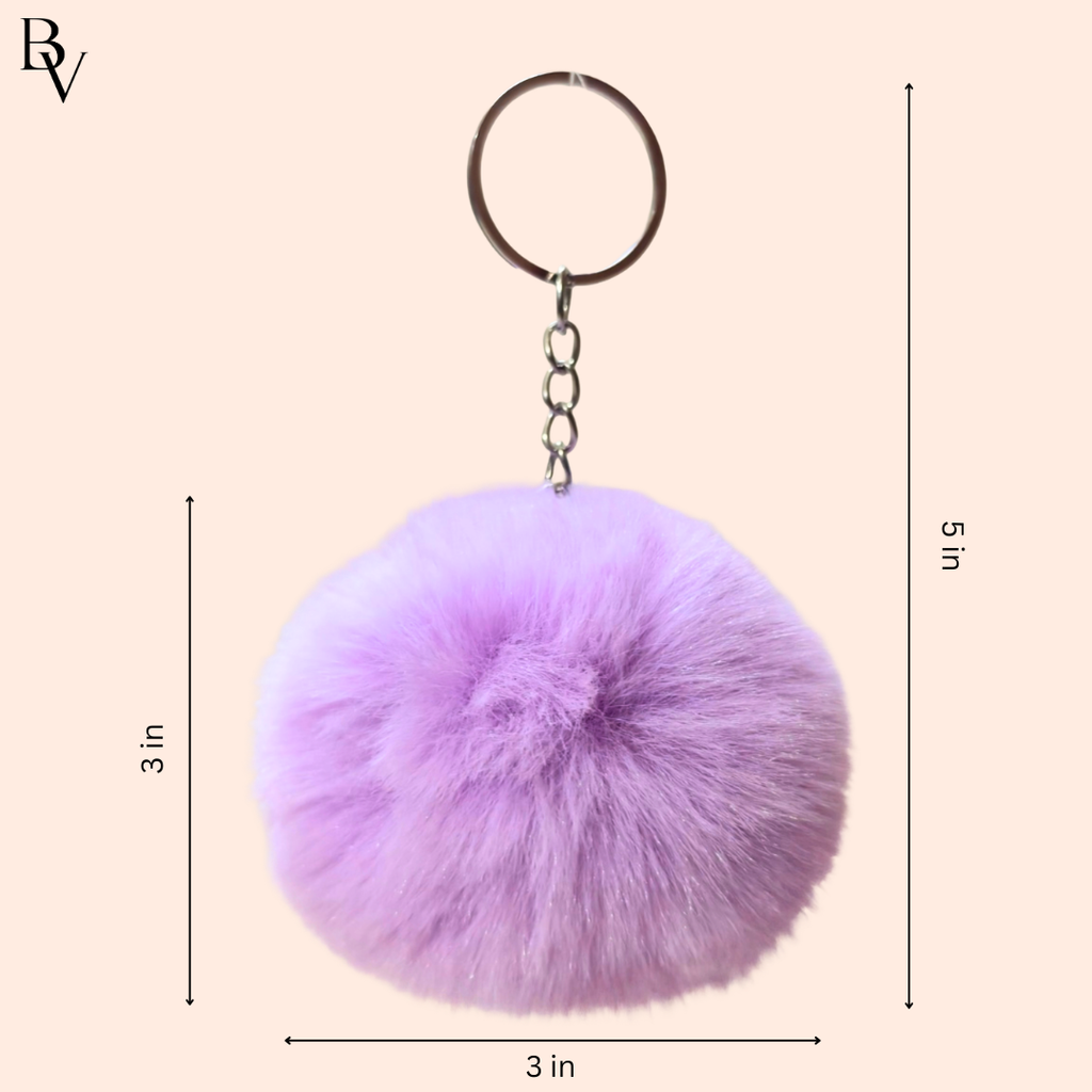 Purple fluffy keychain with measurements on a beige background