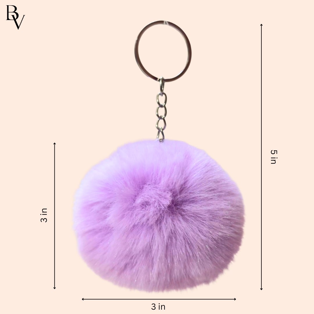 Purple fluffy keychain with measurements on a beige background
