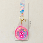 Keychain with a bear design and measurements on a beige background