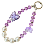Keychain with purple butterfly and pearl beads on a white background