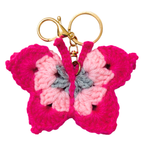 Crocheted butterfly keychain with pink body and gray center on a white background