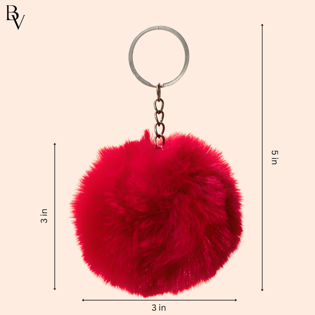 Key Chain Showing Measurement In Front Of White Background.