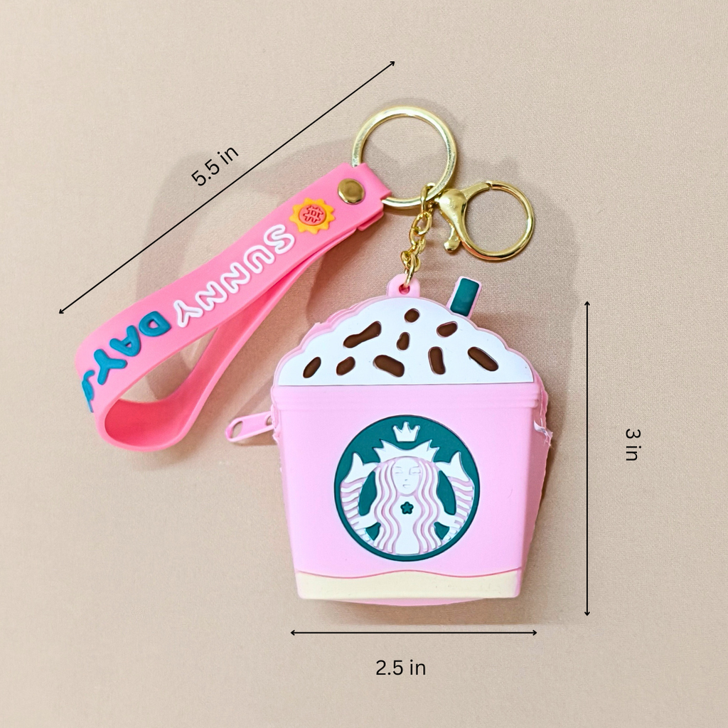 Pink Starbucks air pod case with keychain and measurements on a beige background