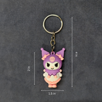 Keychain with cartoon character and measurements on a dark background