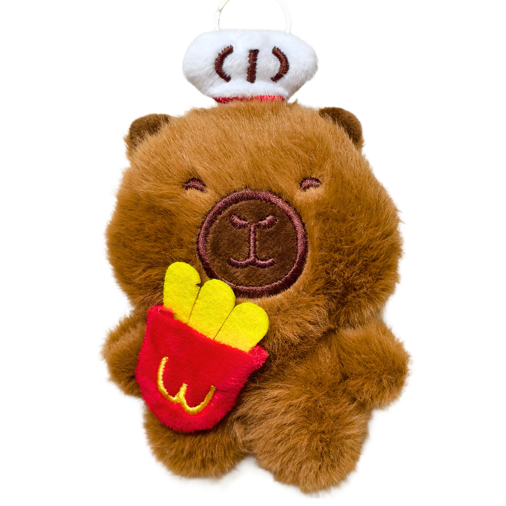 Plush toy bear wearing a chef's hat and holding a hot dog on a white background