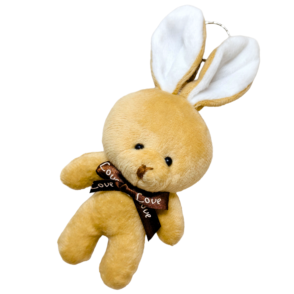 Plush toy bear with bunny ears and a 'love' ribbon on a white background
