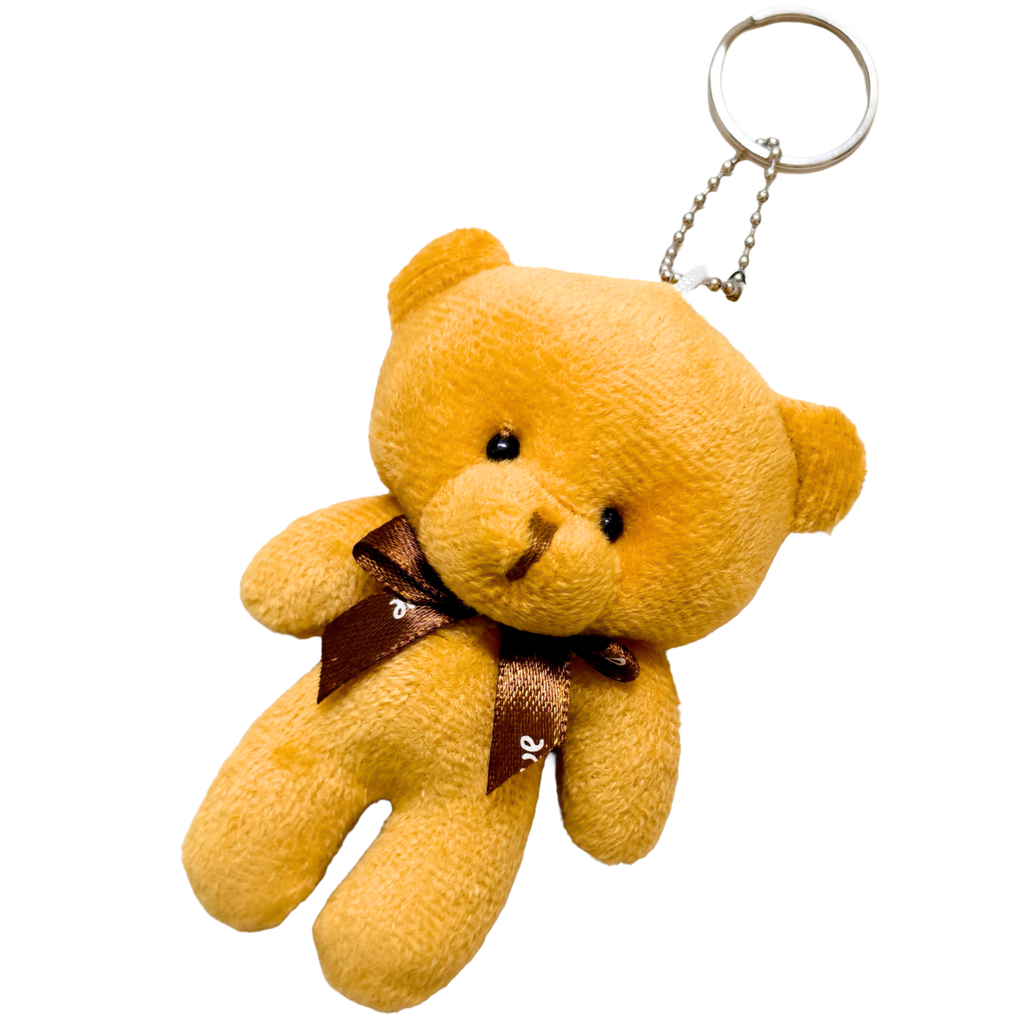 Yellow teddy bear keychain with a brown bow on a white background