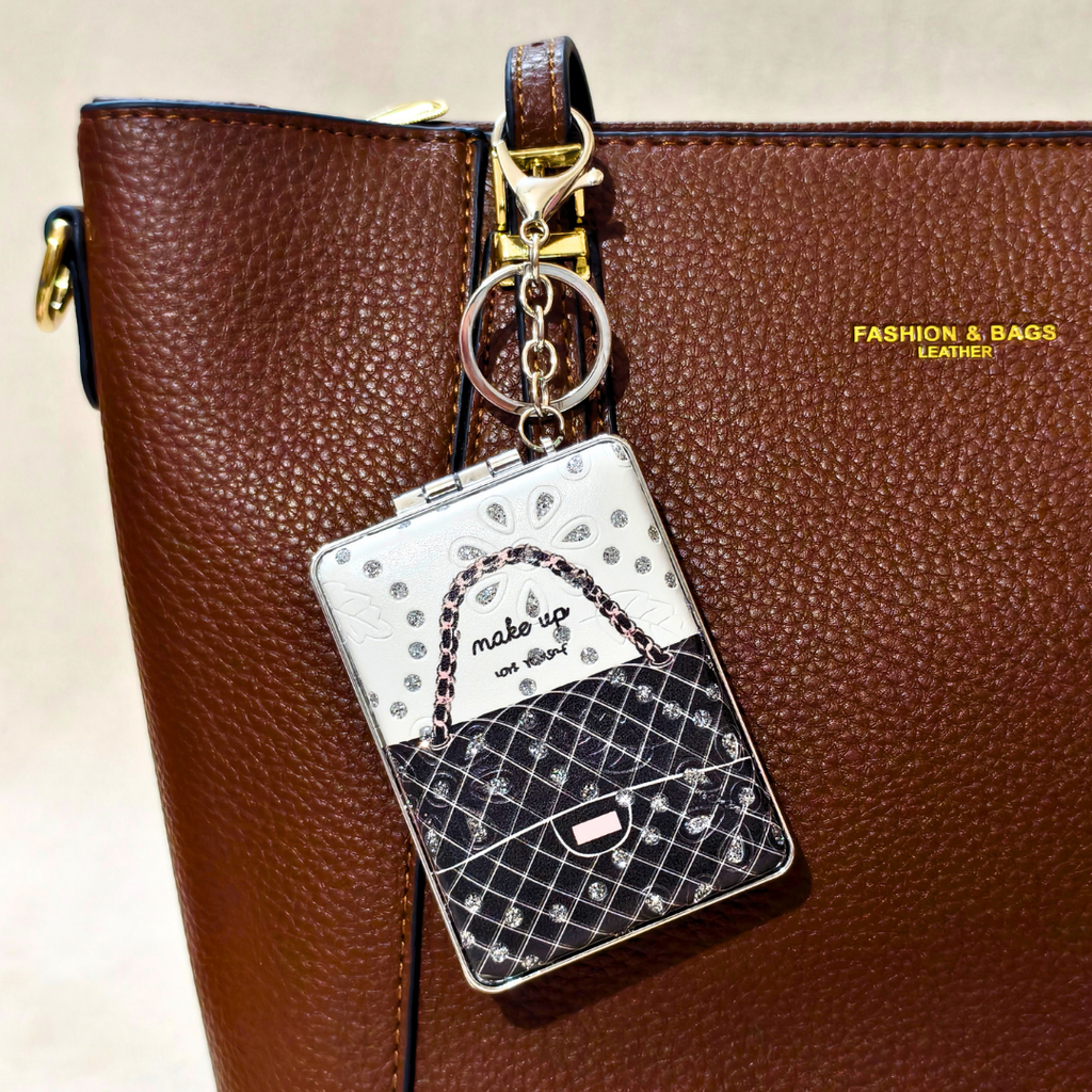 Rectangle Bag Black Pocket Mirror Attached With Purse As  Bag Charm On  Beige Background.